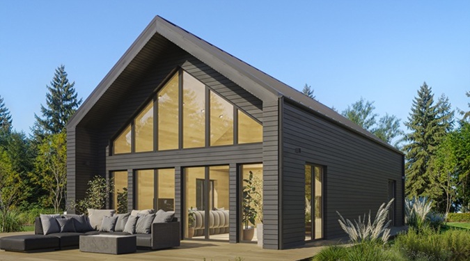 Casas estilo granero contemporáneas con fachadas de madera negra y ventanas panorámicas.